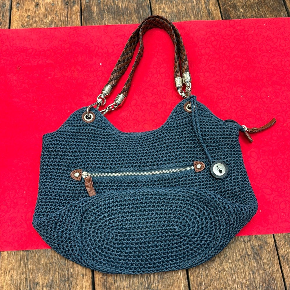 The Sak crochet blue bag